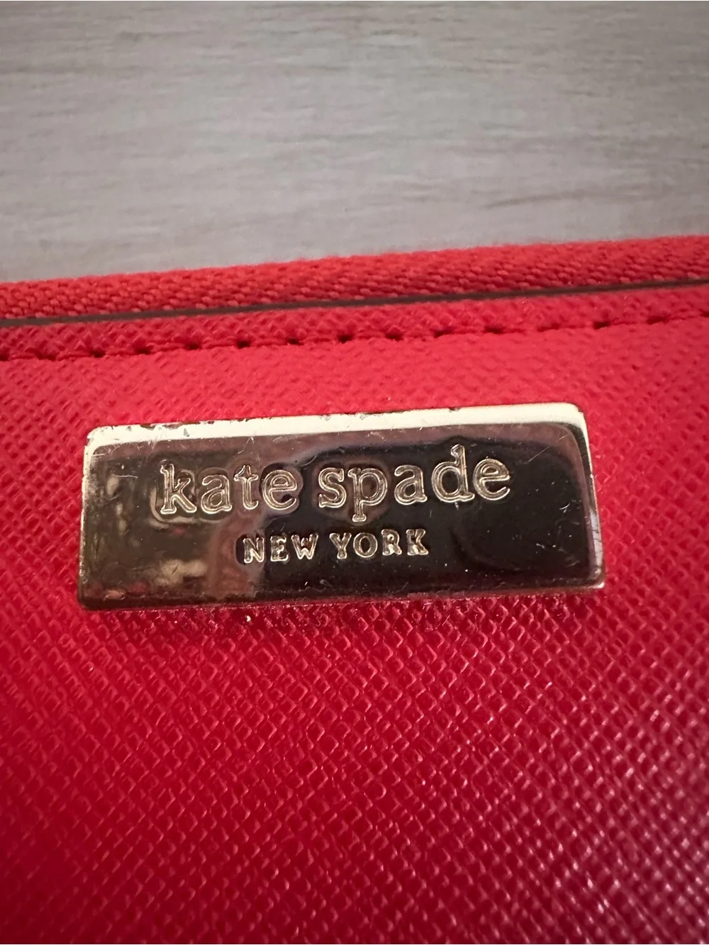 kate spade red saffiano continental wallet with gold plaque